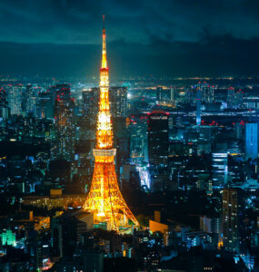 Tokyo Tower at night: iconic landmark in Japans capital, illuminated in golden light.
