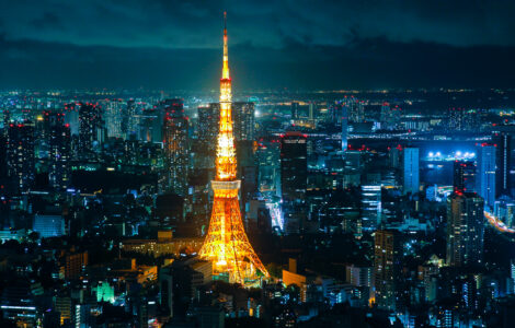 Tokyo Tower at night: iconic landmark in Japans capital, illuminated in golden light.