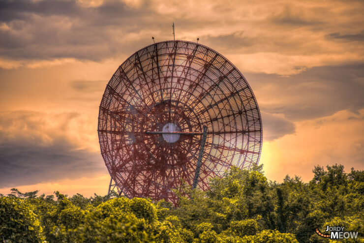 Explore the decaying antenna in Fuchu, a forgotten relic in natures embrace.
