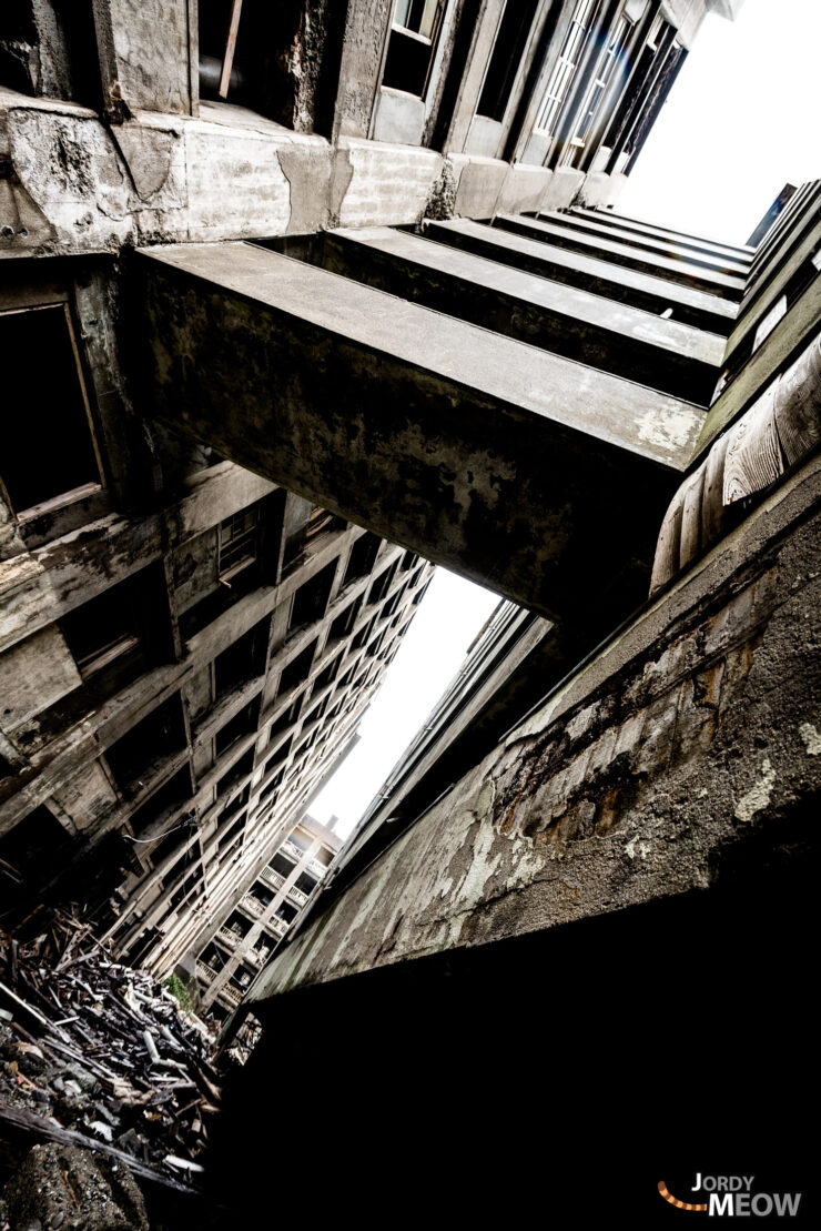 The Ghost Island of Nagasaki: Abandoned city frozen in time, eerie and haunting.