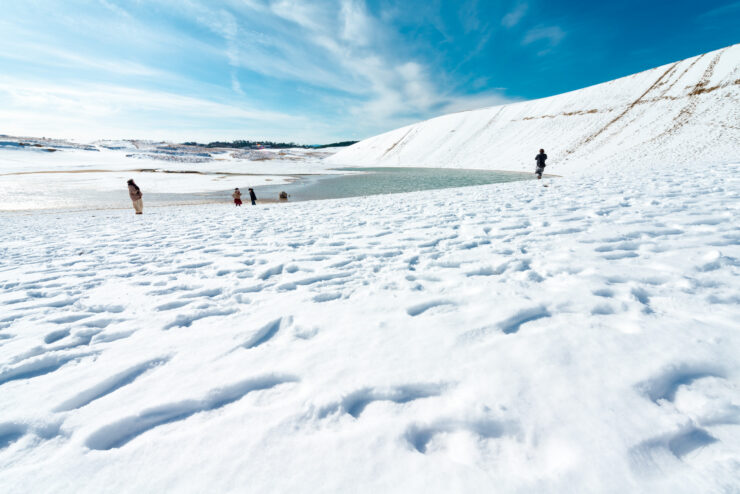 Winter Wonderland: Snow-covered Tottori Sand Dunes and Frozen Lake.