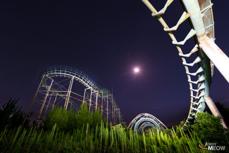 Eerie night view of abandoned Nara Dreamland Roller Coaster in Japan.