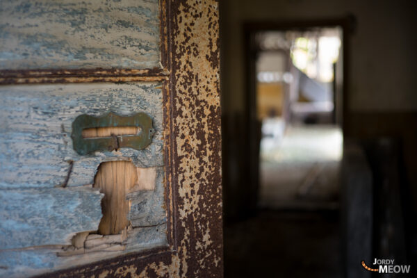 Exploring the abandoned Wagakawa Hydro Plant in Tohoku, Japan among autumn leaves.