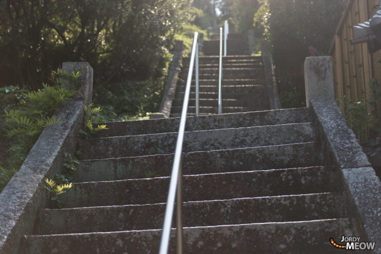Exploring Historic Uchiko: Serene Stone Steps and Greenery.