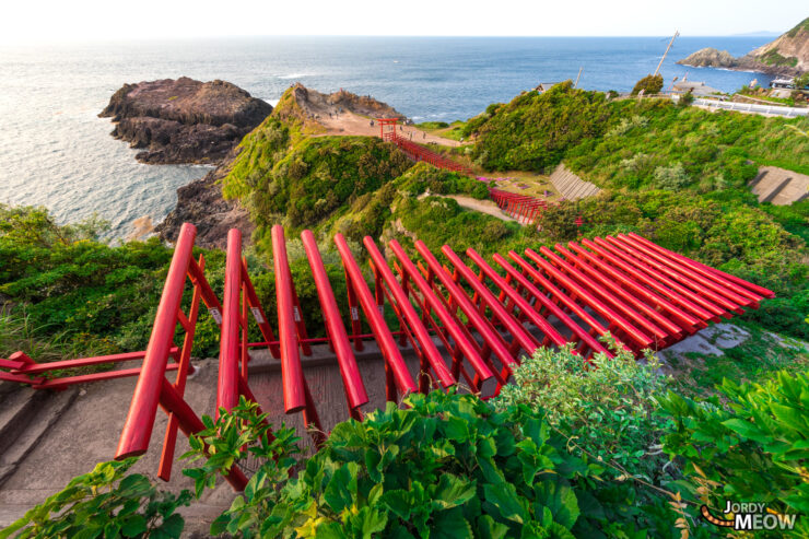 Motonosumi Inari Shrine: Stunning red torii gates on Japan Seas rugged coast.