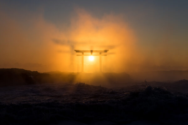 Tranquil sunset at Oarai Isosaki Shrine in Japan, with iconic torii gate.