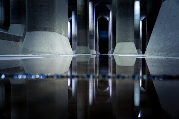 The Underground Miracle: Impressive Subterranean Structure with Water Flowing Through Massive Arches.