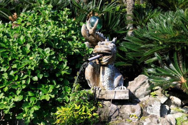 Enchanting Dragon Sculpture in Mythical Garden at Runin Cemetery.