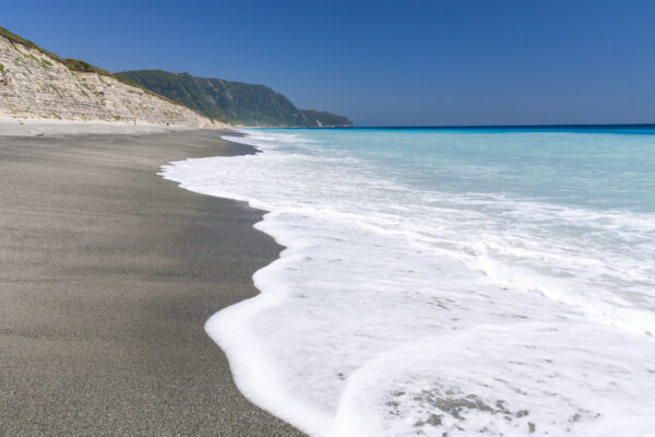 Niijimas Stunning White Cliffs Overlooking Turquoise Ocean and Sandy Beach.