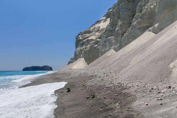 Majestic White Cliffs of Niijima, Japan: A breathtaking natural wonder of rhyolite lava formations.