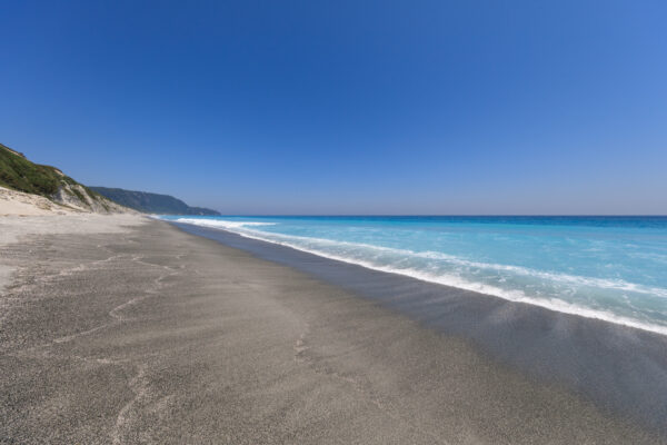 Niijimas Pristine White Cliffs: Tranquil coastal beauty with towering rhyolite cliffs and turquoise waters.