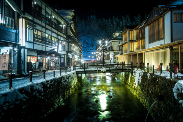 Charming Ginzan Onsen: Traditional Japanese hot spring resort nestled in the Alps.