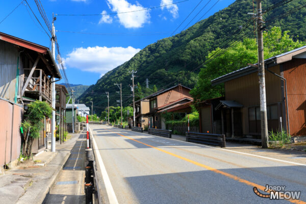 Unlocking the Universe: Super-Kamiokande Neutrino Observatory nestled in serene Japanese landscape.