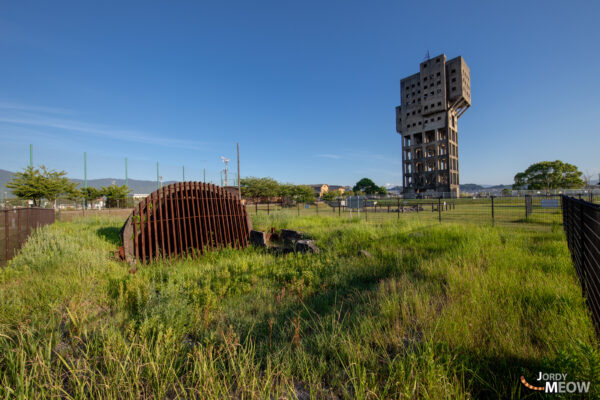 Decaying Fukuoka coal mine tower reclaimed by nature.