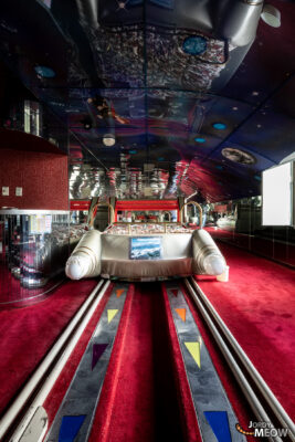 Vibrant abandoned Japanese love hotel bowling alley interior