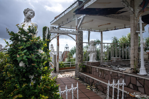 Haunting ruins of forgotten wedding venue reclaimed by nature.