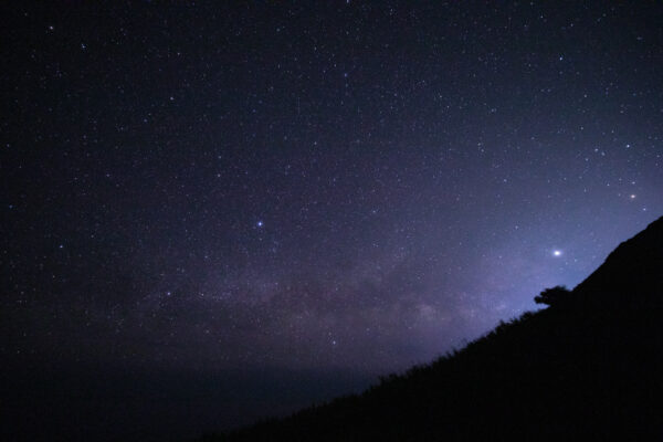 Milky Way night sky over serene ranch landscape