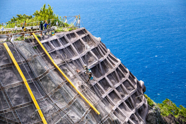 Explore Aogashimas rugged volcanic beauty, wooden trails.