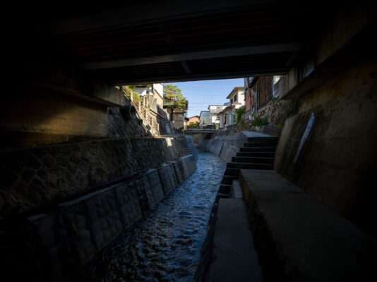 Tranquil Japanese riverfront town with historic architecture