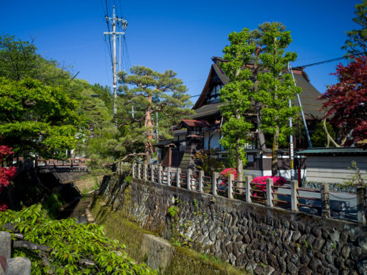 Tranquil Japanese riverside scenery with architecture