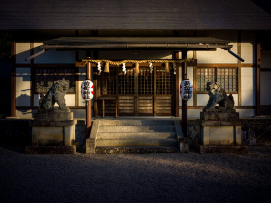 Lantern-lit Kyoto shrine on historic walking trail.