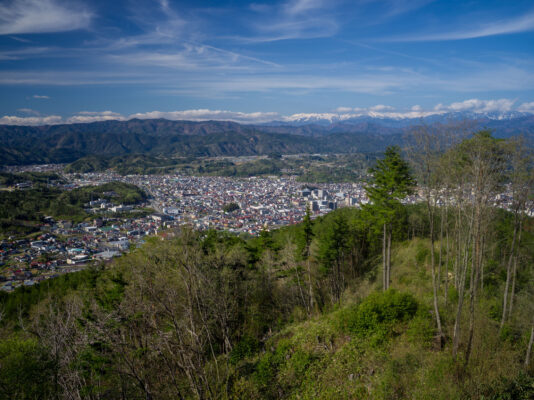 Historic Japanese castle overlooking mountain town