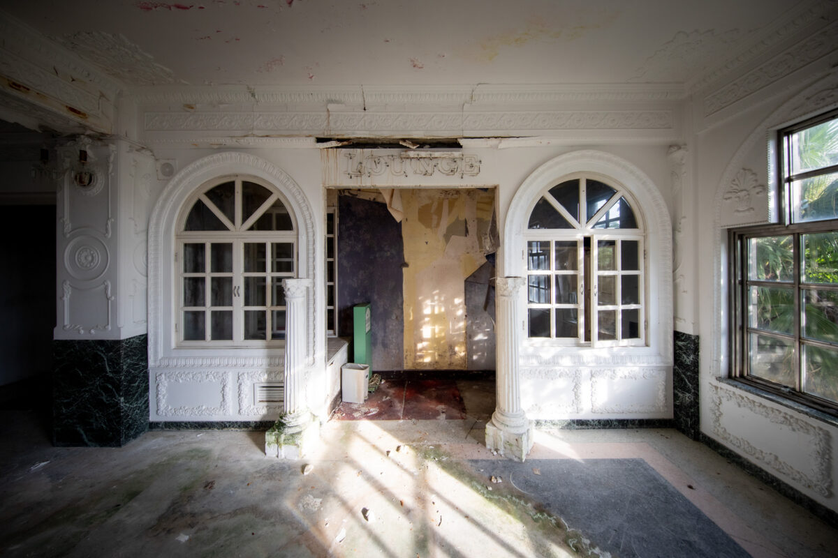 Abandoned opulent Hachijo hotel, crumbling grandeur.