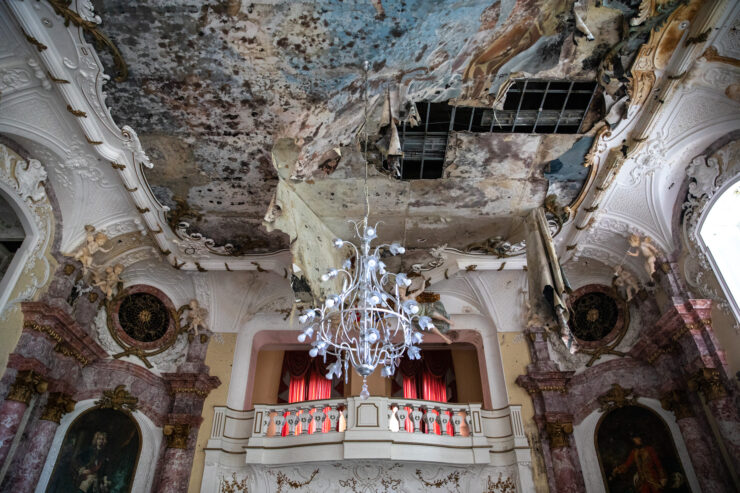 Decaying opulence: Abandoned palace interiors haunting grandeur.