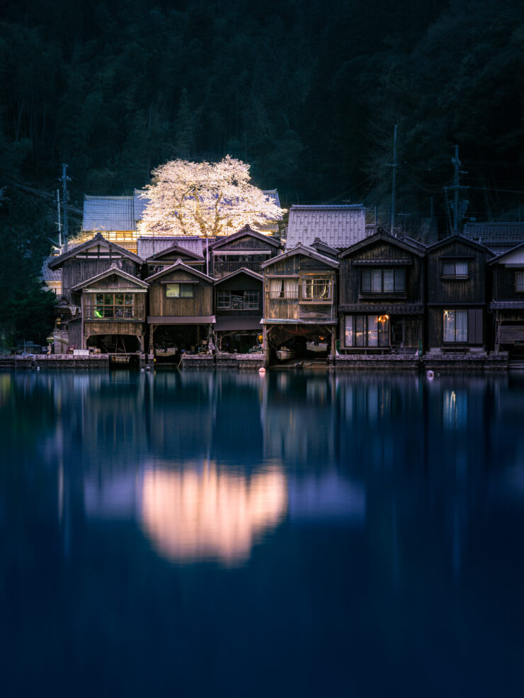 Traditional Japanese boathouse village reflection by night