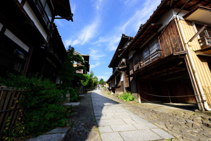 Explore the charm of Magome-juku: historic Japanese post town with traditional architecture and greenery.