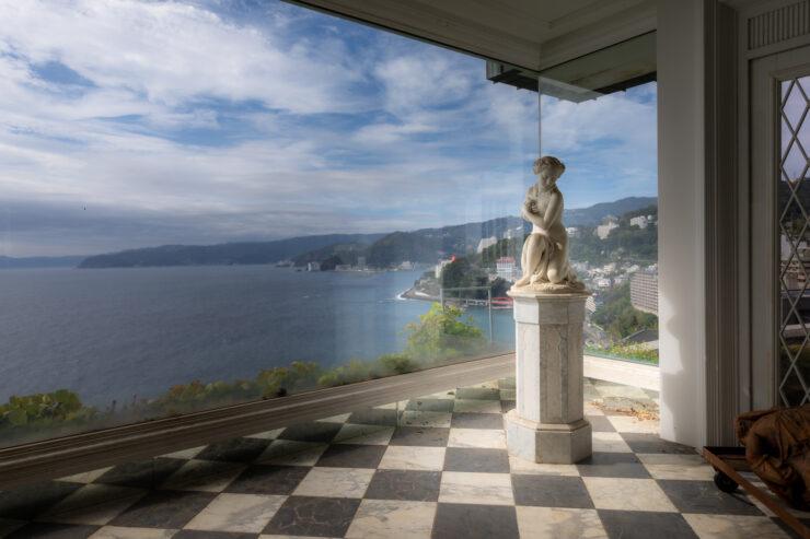 Historic coastal mansion with elegant architecture, panoramic views.