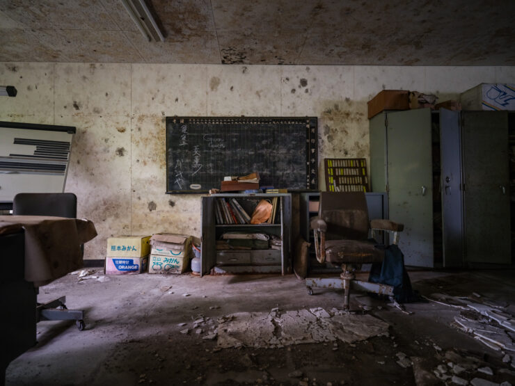 Abandoned classroom ruins, haunting remnant of forgotten education.