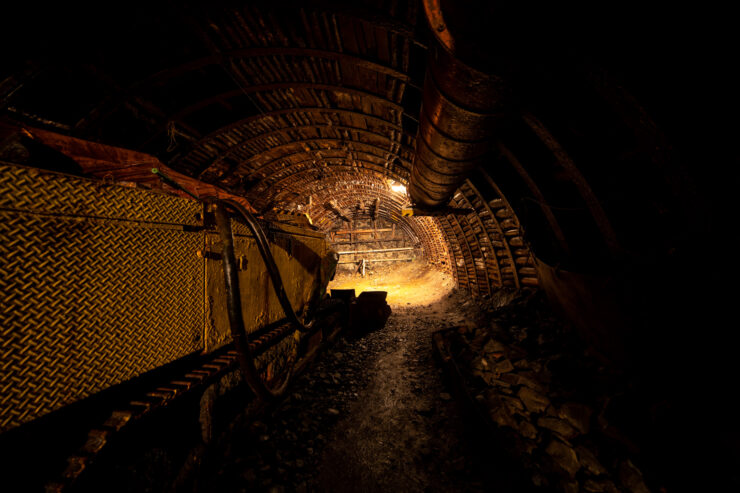 Eerie Abandoned Coal Mine Tunnel Interior Bathed in Light