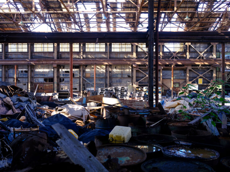 Decaying abandoned warehouse interior, urban decay