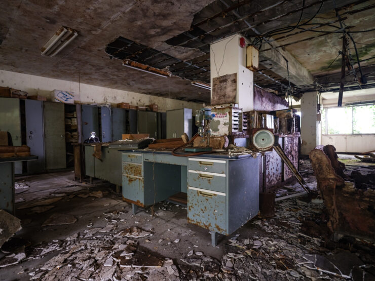 Derelict office interior, haunting decay remnants.