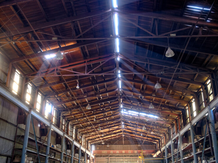 Golden-lit industrial warehouse interior
