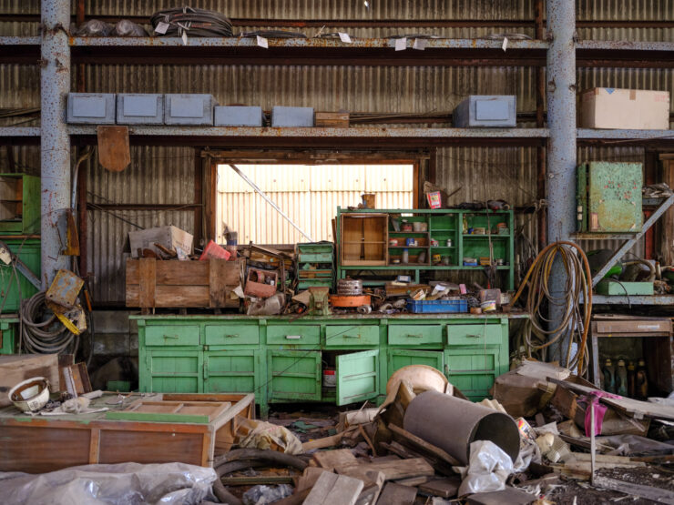 Decaying cluttered industrial workspace interior