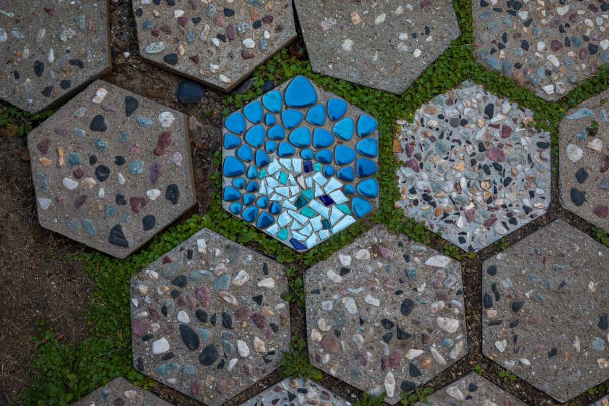 Vibrant hexagonal mosaic pavement in historic Onomichi, Japan.
