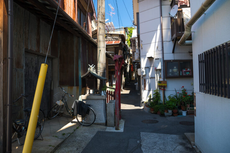 Narrow Japanese alleyway showcases historic architecture charm.