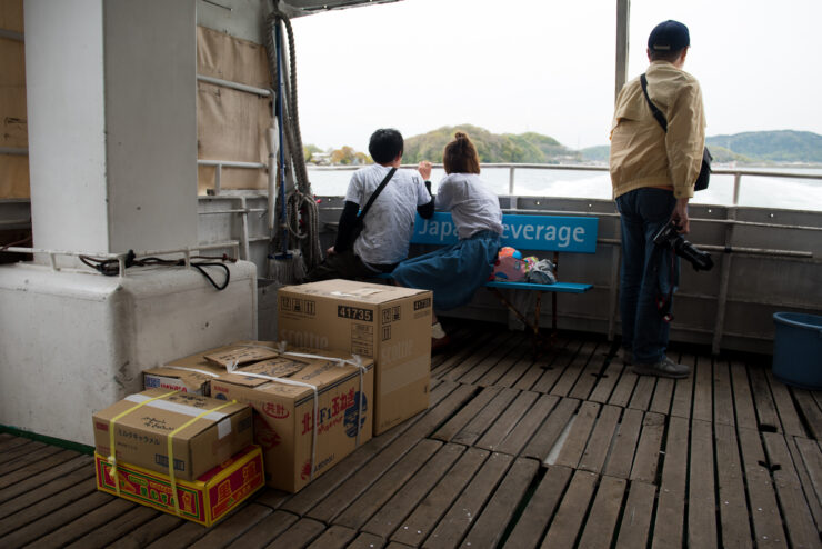 Ferry transporting passengers and cargo in Japans scenic Manabe-shima.