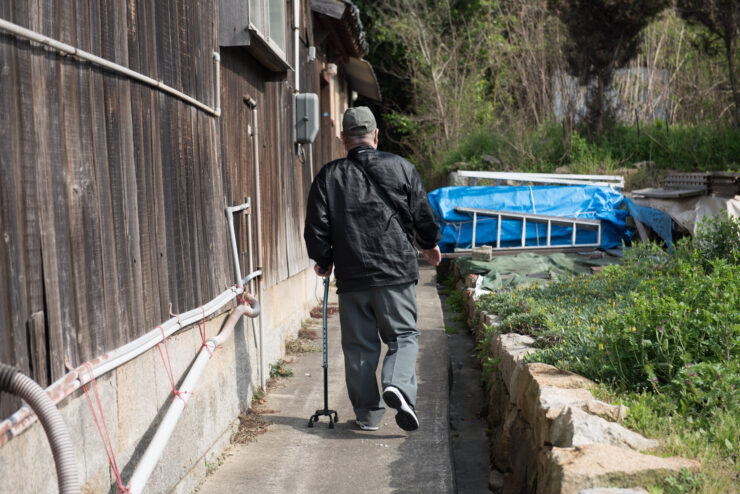 Aging residents solitary path, Manabe-shimas rural isolation.