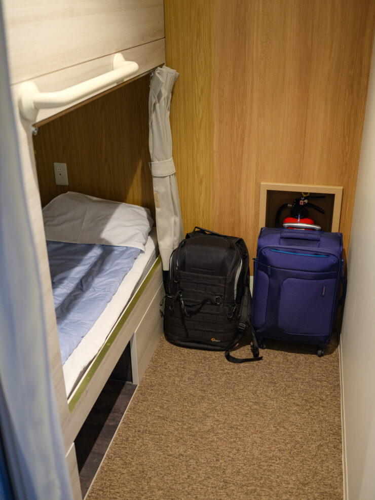 Compact hotel-style bunkbed room interior.