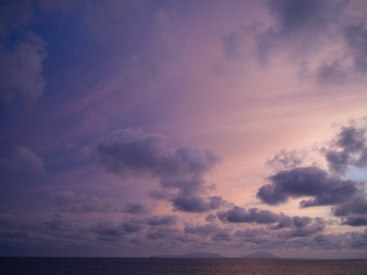 Vibrant Sunset Sky Over Ocean Horizon