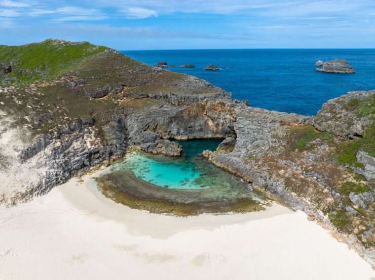 Secluded Turquoise Beach Cove, Rocky Coastal Cliffs