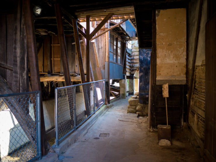Abandoned Industrial Hallway: Weathered Beauty Awaits
