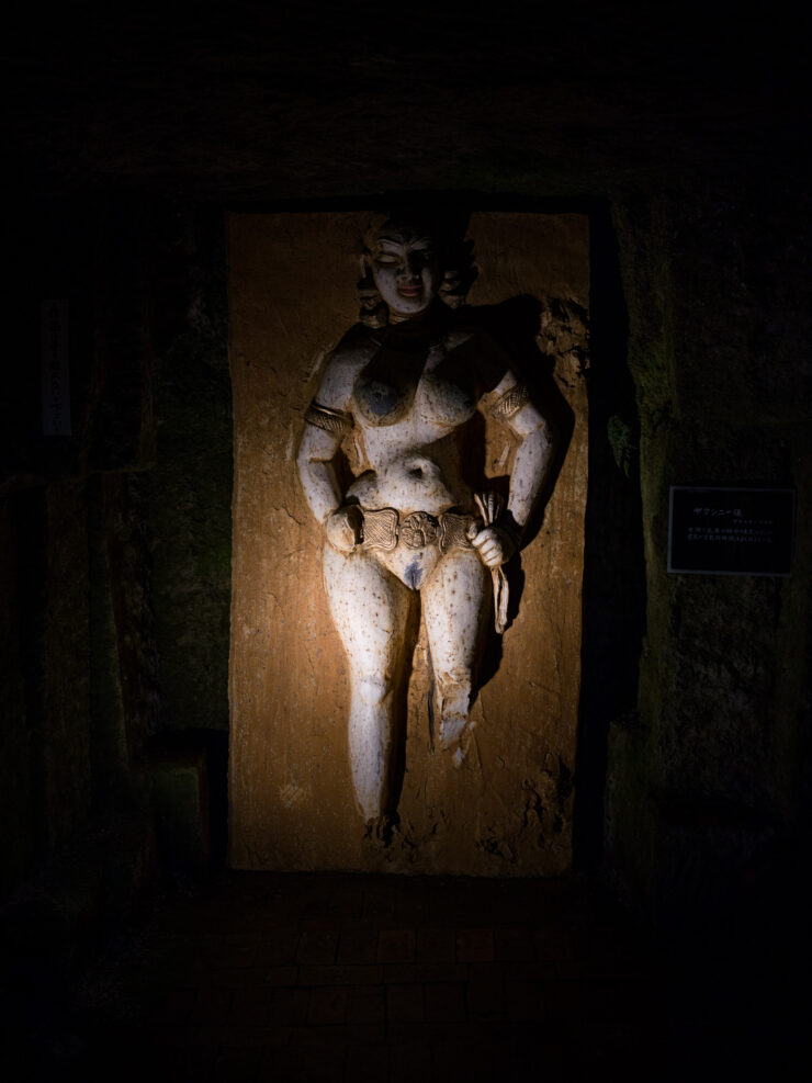 Sculpted nude male figure, Yuma Tsugatas illuminated Hanibe Caves masterpiece.