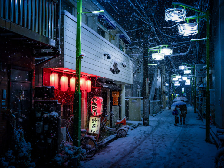 Atmospheric snowy Tokyo alleyway at night