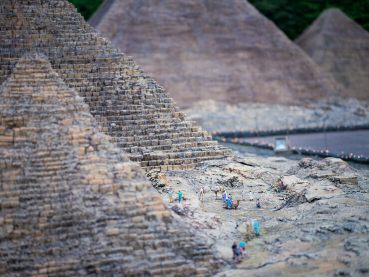 Mayan stone pyramids amidst lush nature scenery.