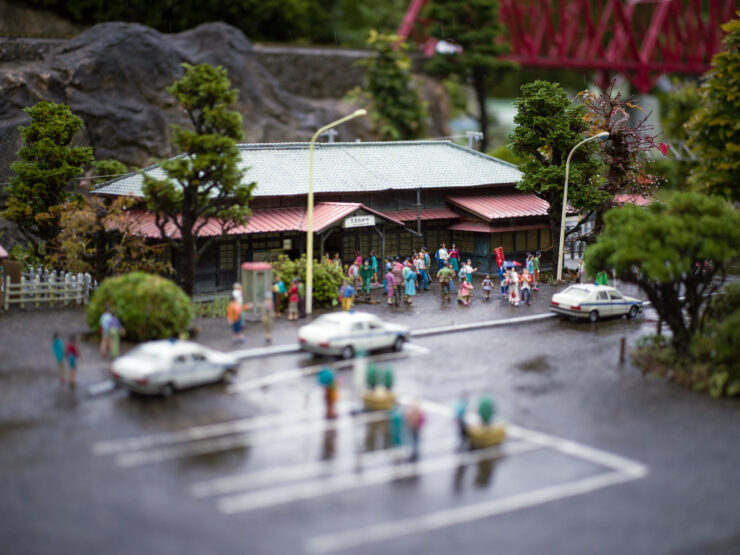 Intricate miniature village market diorama, whimsical delight.