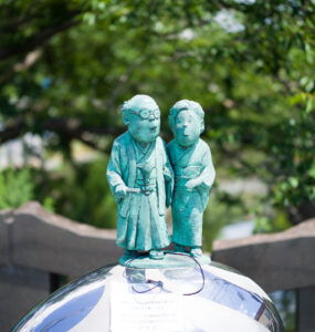 Mizuki Shigerus fantasy bronze children statues on sphere
